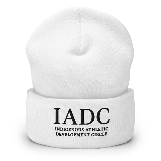 White beanie with 'IADC Indigenous Athletic Development Circle' logo.