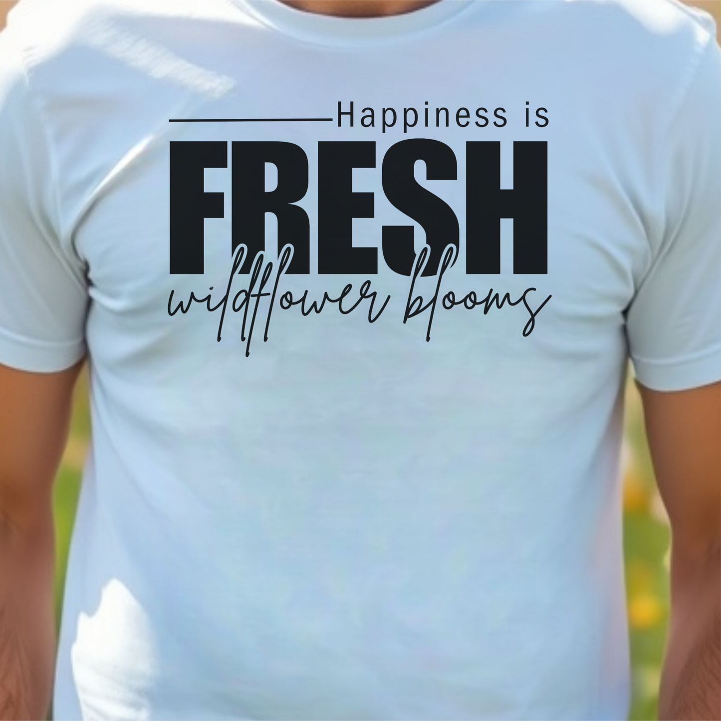 White t-shirt with text 'Happiness is fresh wildflower blooms'.