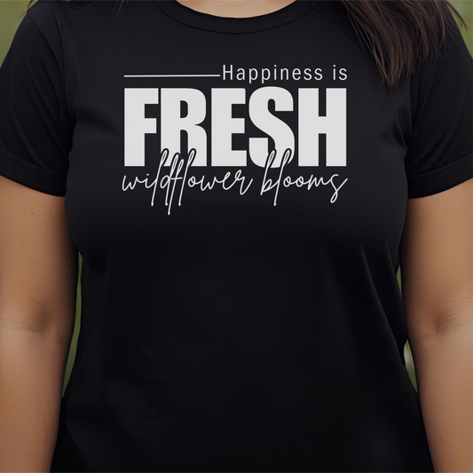 Black t-shirt with text 'Happiness is fresh wildflower blooms'.