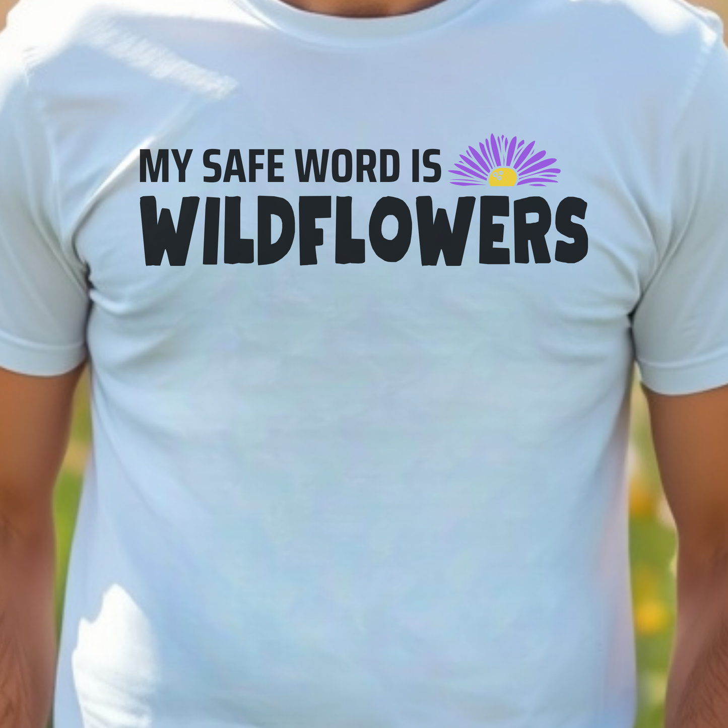 White t-shirt with 'My Safe Word is Wildflowers' text and a flower graphic.