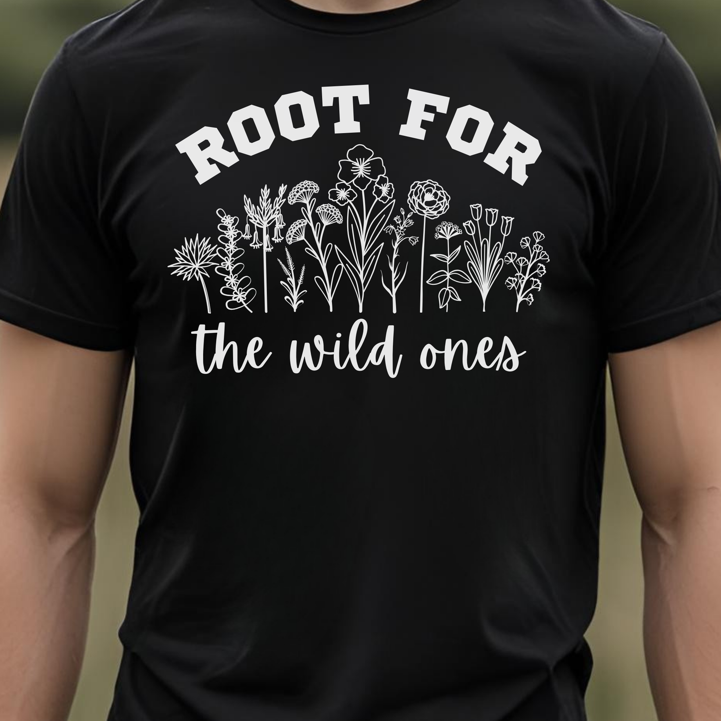 Black t-shirt with floral design and text 'Root for the wild ones'.