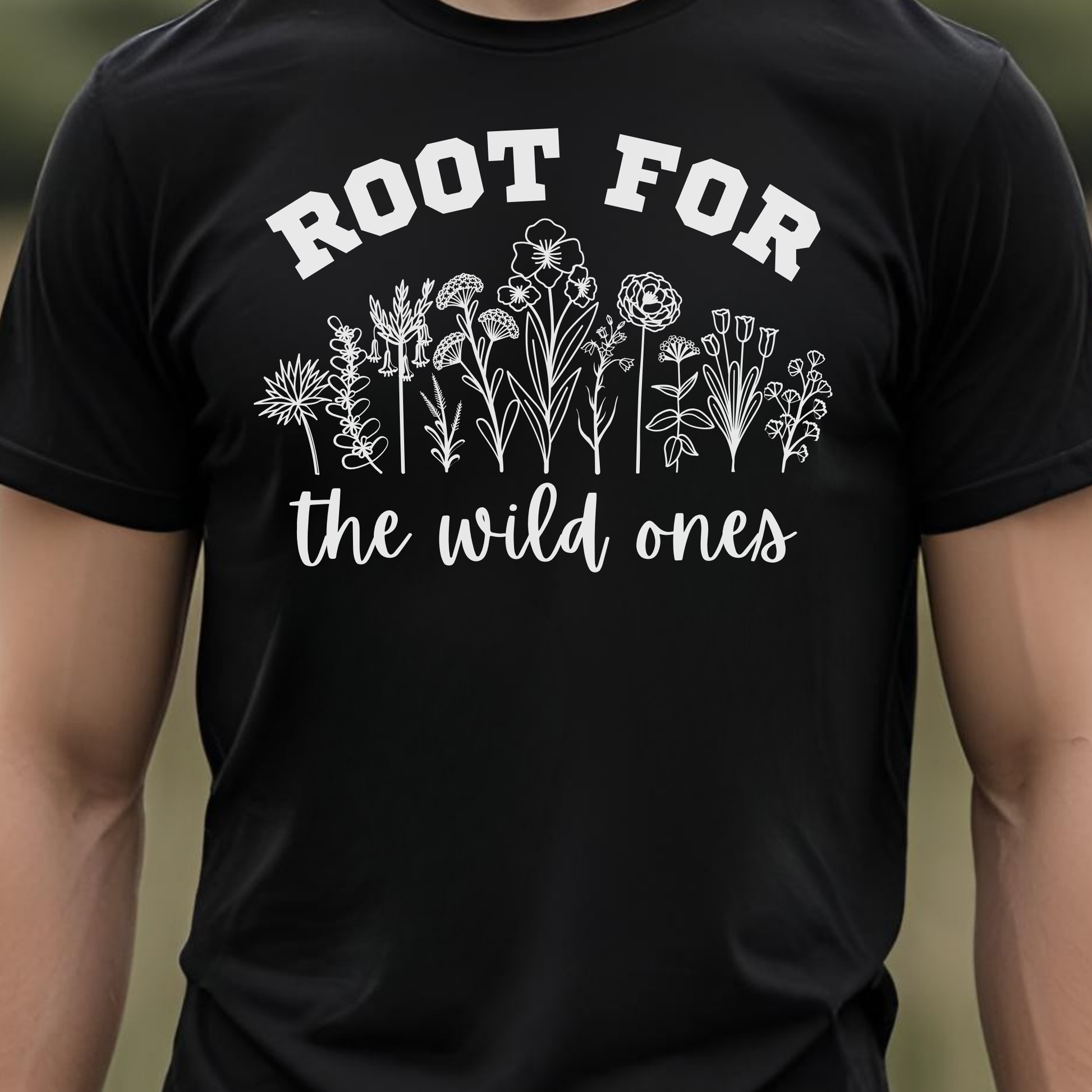 Black t-shirt with floral design and text 'Root for the wild ones'.