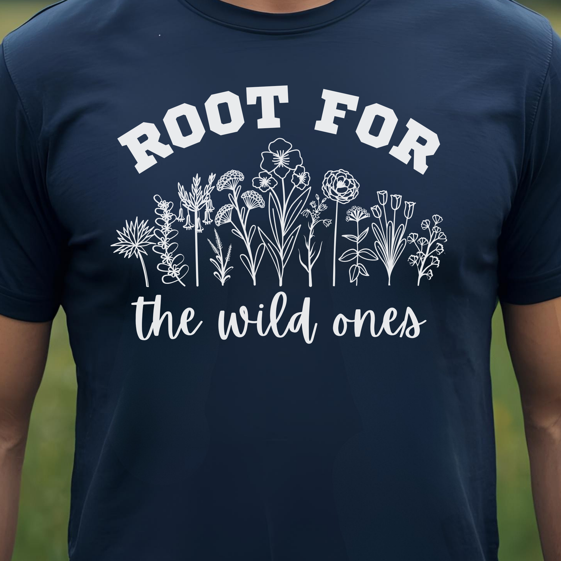 Navy t-shirt with white floral design and text 'Root for the wild ones'.
