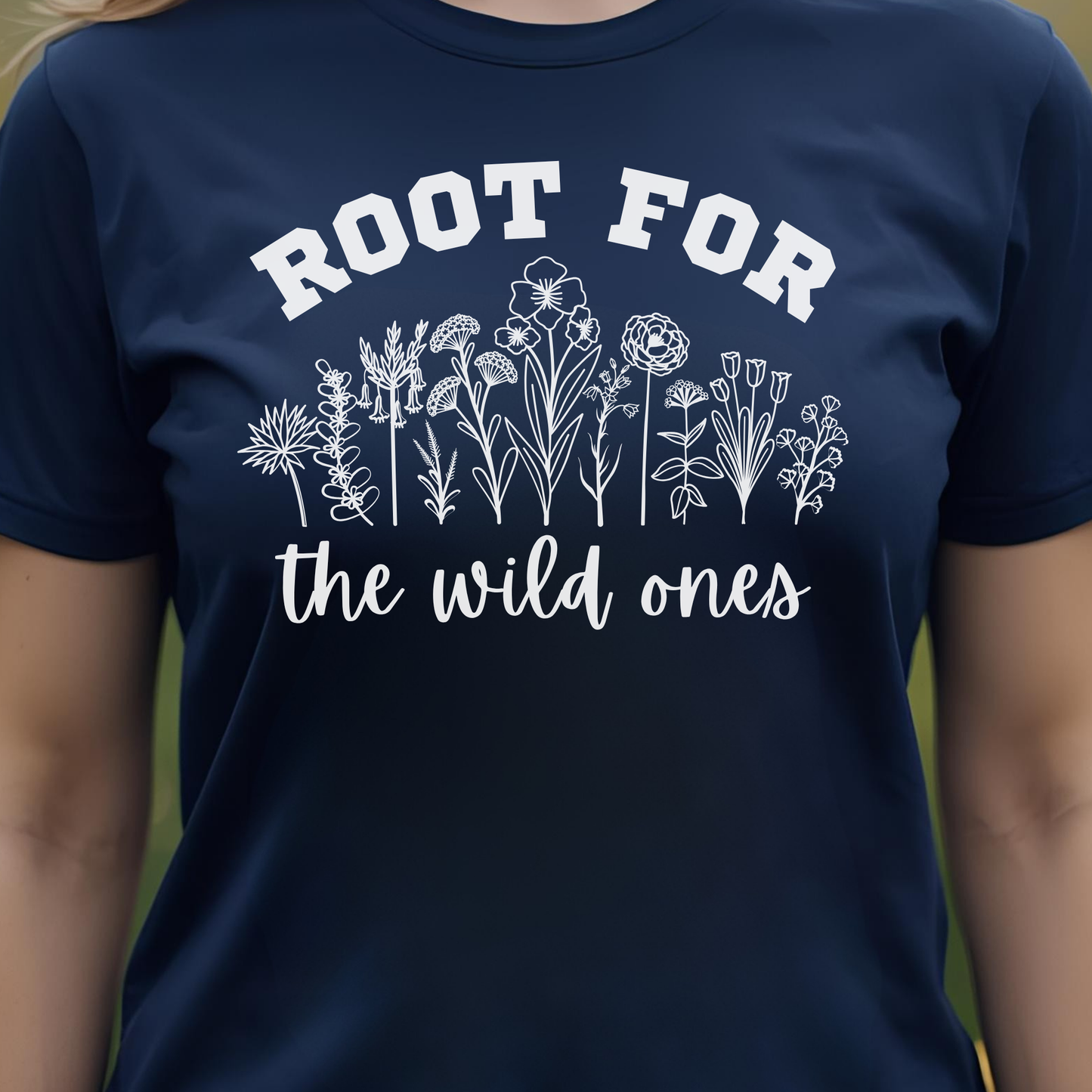 Navy t-shirt with white floral design and text 'Root for the wild ones'.