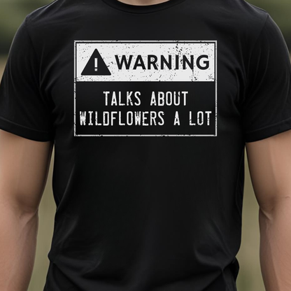 Black t-shirt with a warning sign graphic and text.