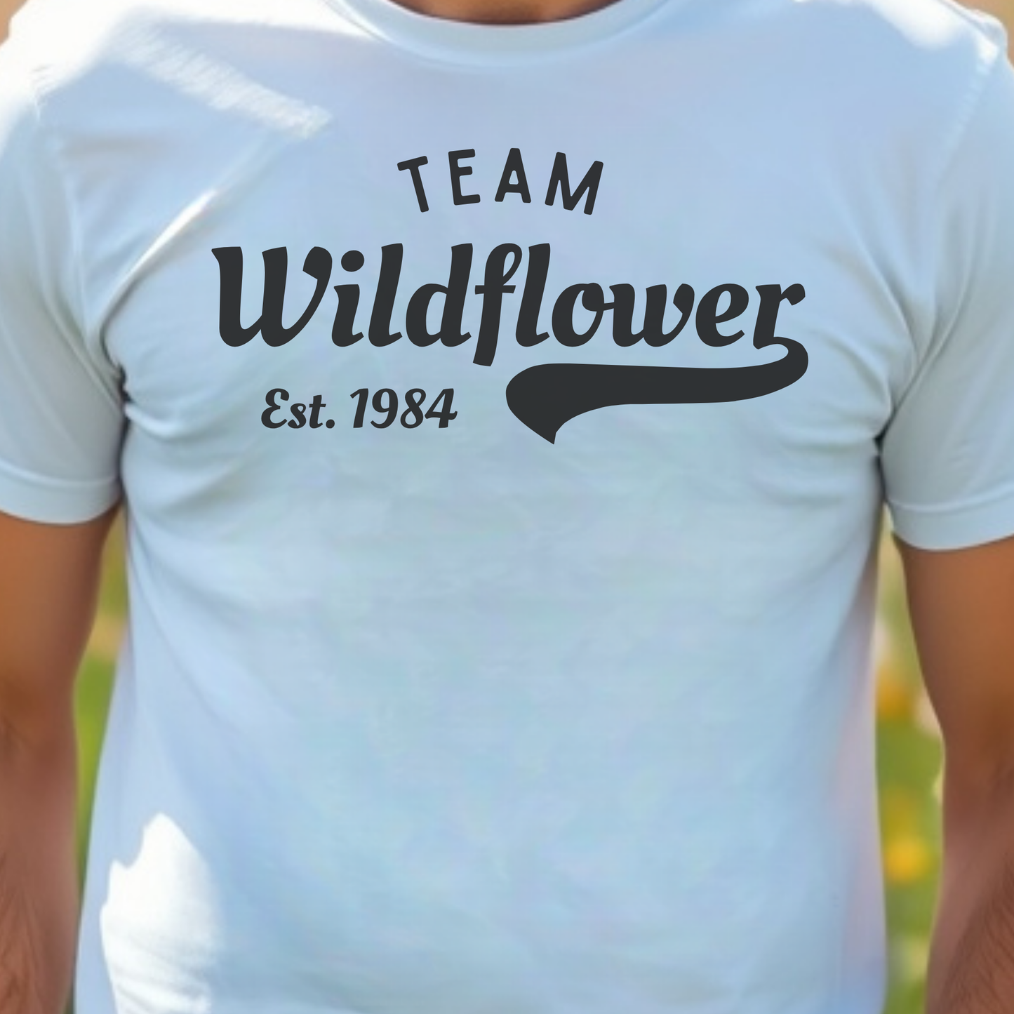 White t-shirt with 'Team Wildflower Est. 1984' text.