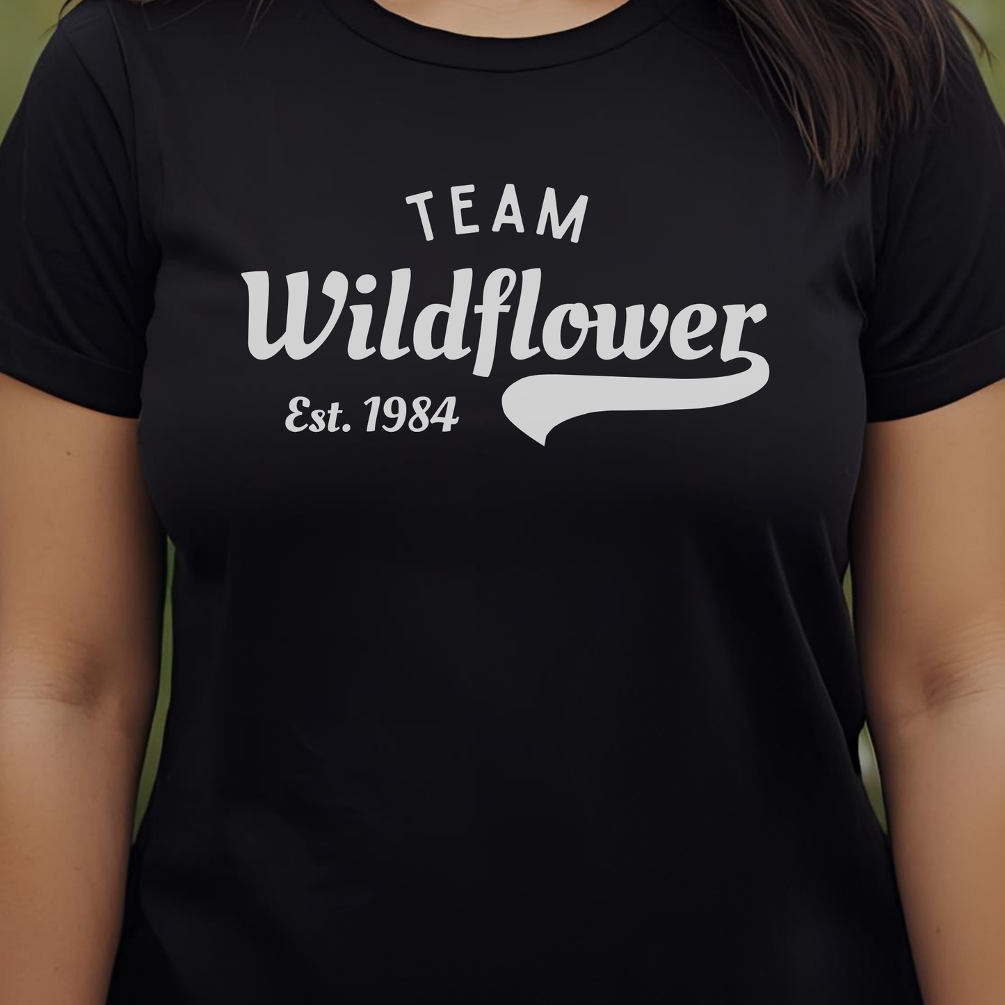 Black t-shirt with 'Team Wildflower Est. 1984' text.