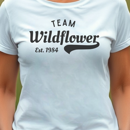 White t-shirt with 'Team Wildflower Est. 1984' text.