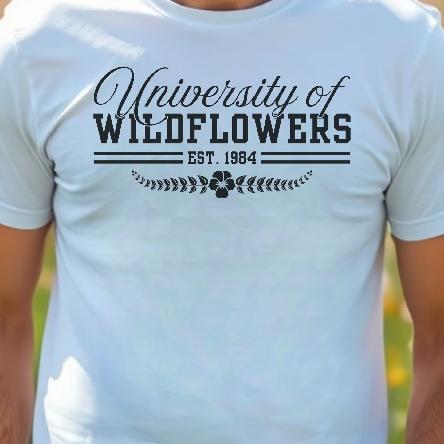 White t-shirt with 'University of Wildflowers'.