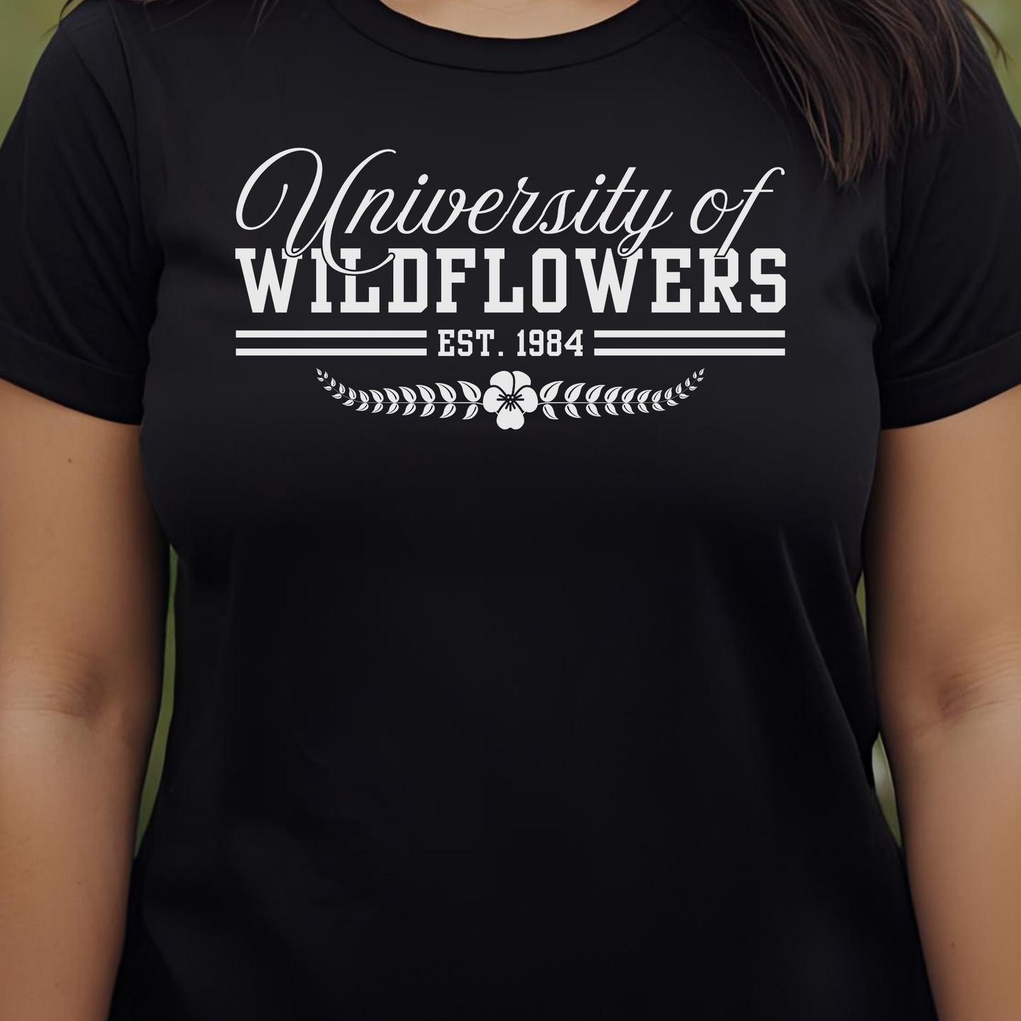 Black t-shirt with 'University of Wildflowers'.