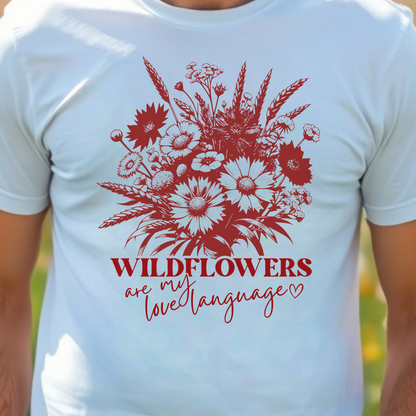 White t-shirt with red floral design and text 'Wildflowers are my love language'.