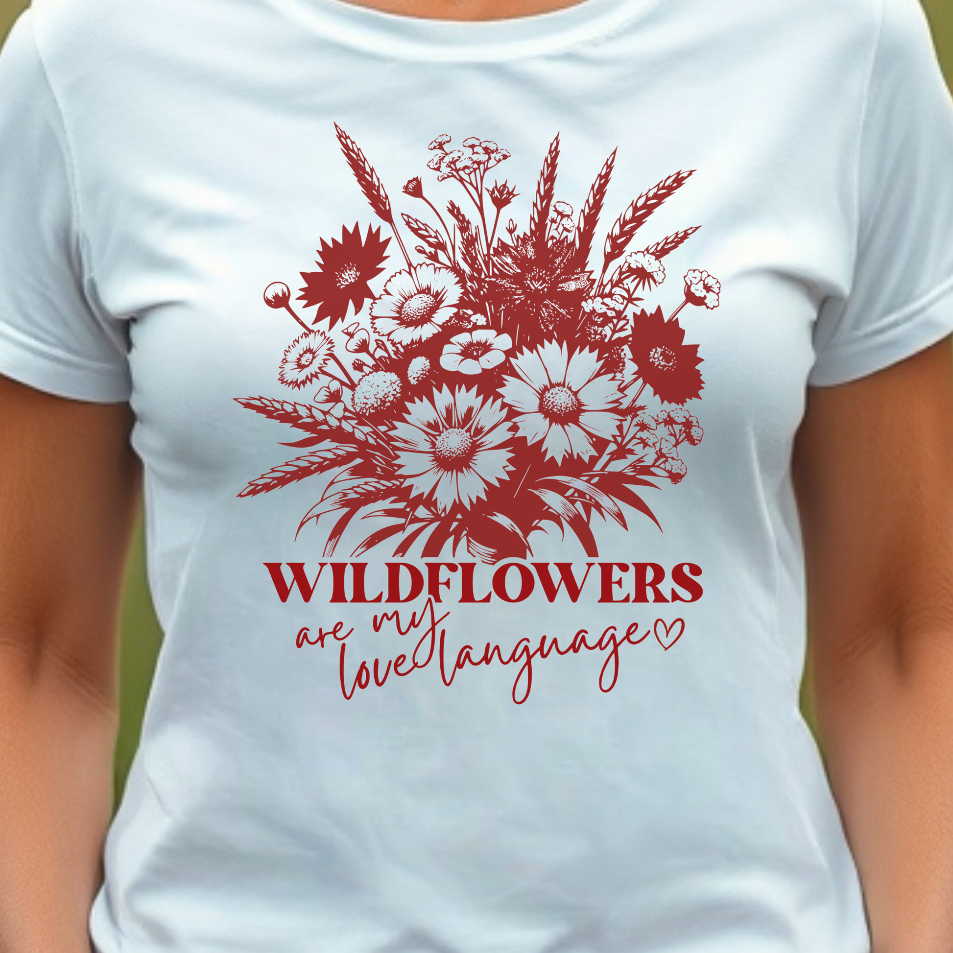 White t-shirt with red floral design and text 'Wildflowers are my love language'.