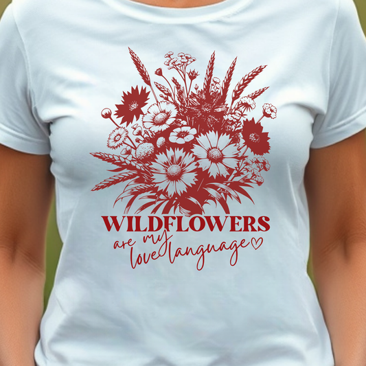 White t-shirt with red floral design and text 'Wildflowers are my love language'.