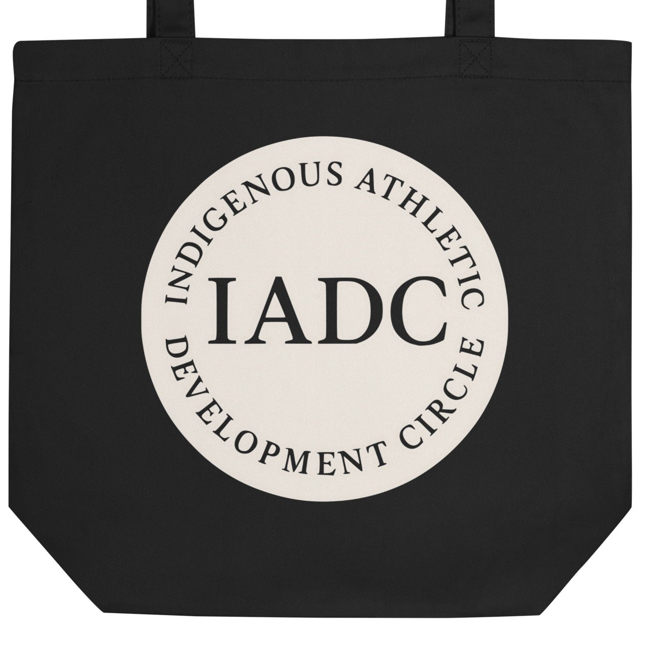 Black tote bag with 'IADC' logo.