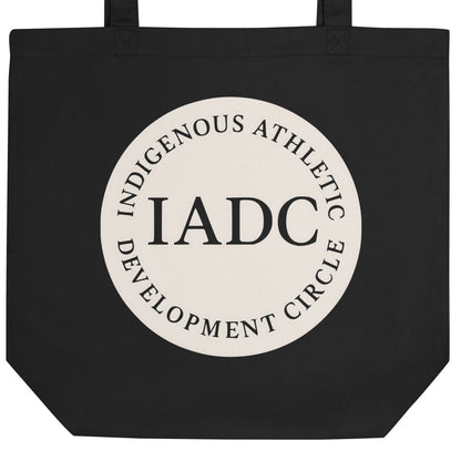 Black tote bag with 'IADC' logo.