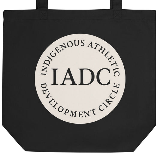 Black tote bag with 'IADC' logo.