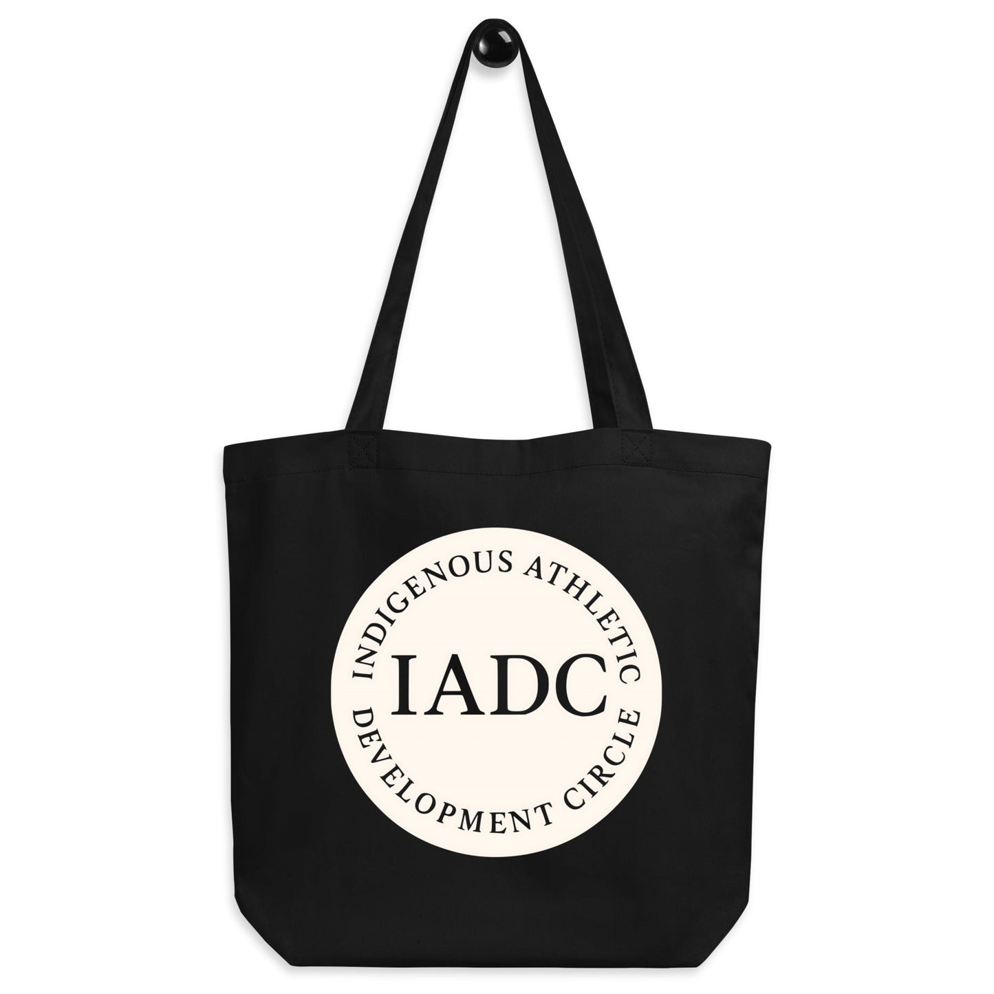 Black tote bag with 'IADC' logo.