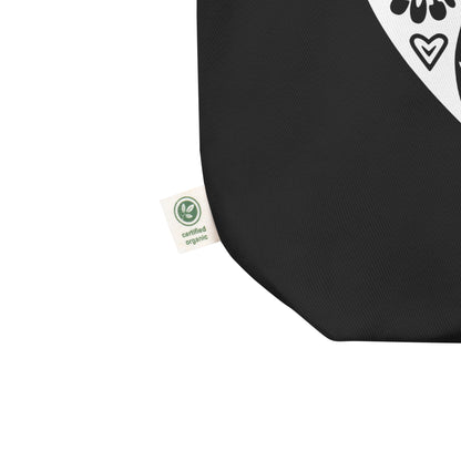 Black tote bag with a certified organic label.
