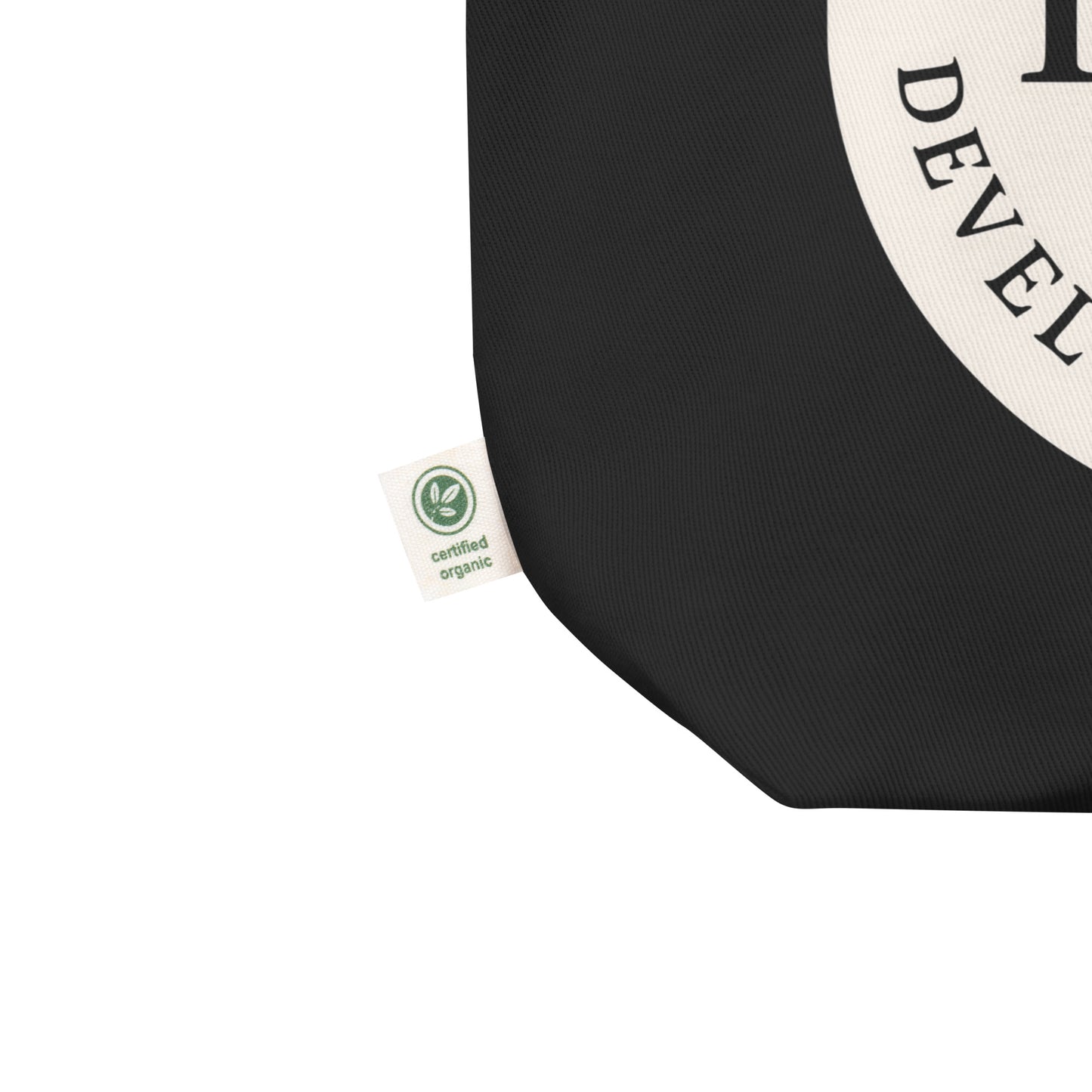 Black tote bag with a certification organic label.
