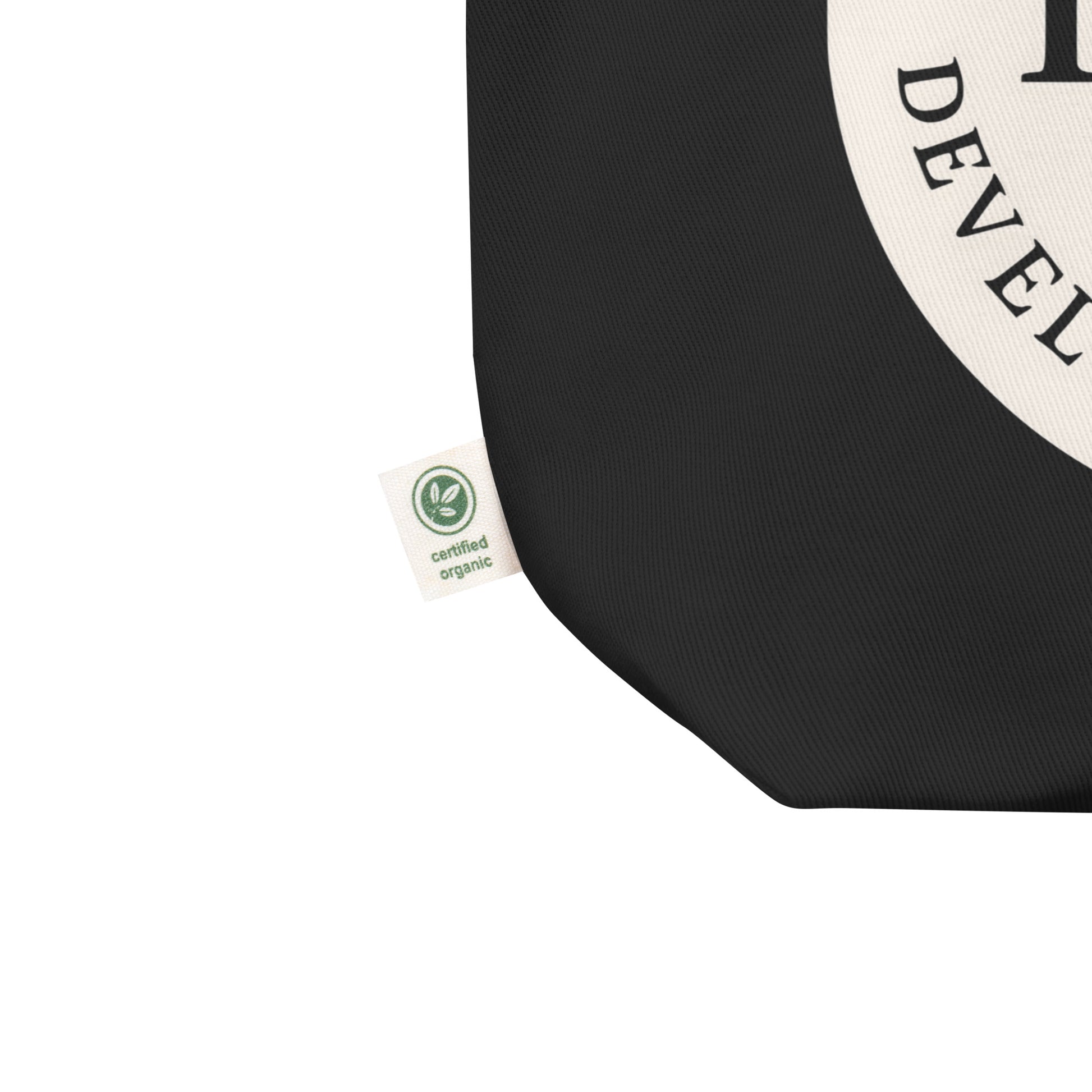 Black tote bag with a certification organic label.