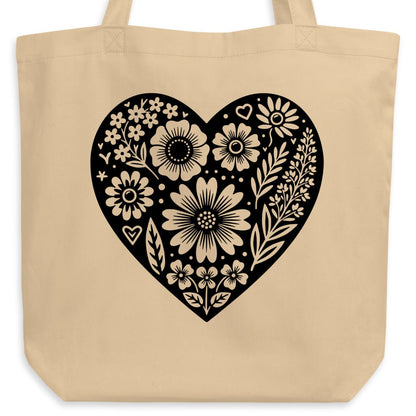 Beige tote bag with a black floral heart design.