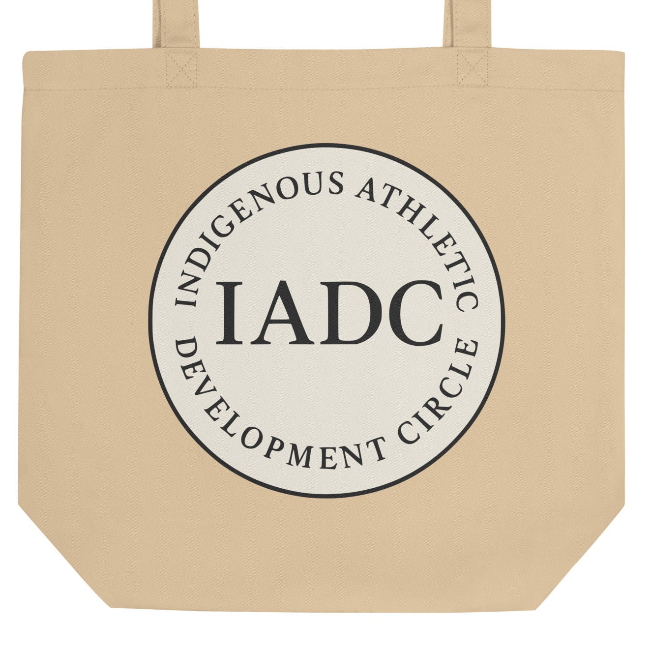 Beige tote bag with 'IADC' logo.