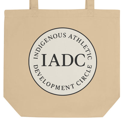 Beige tote bag with 'IADC' logo.