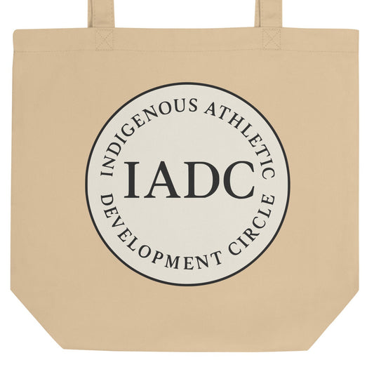 Beige tote bag with 'IADC' logo.