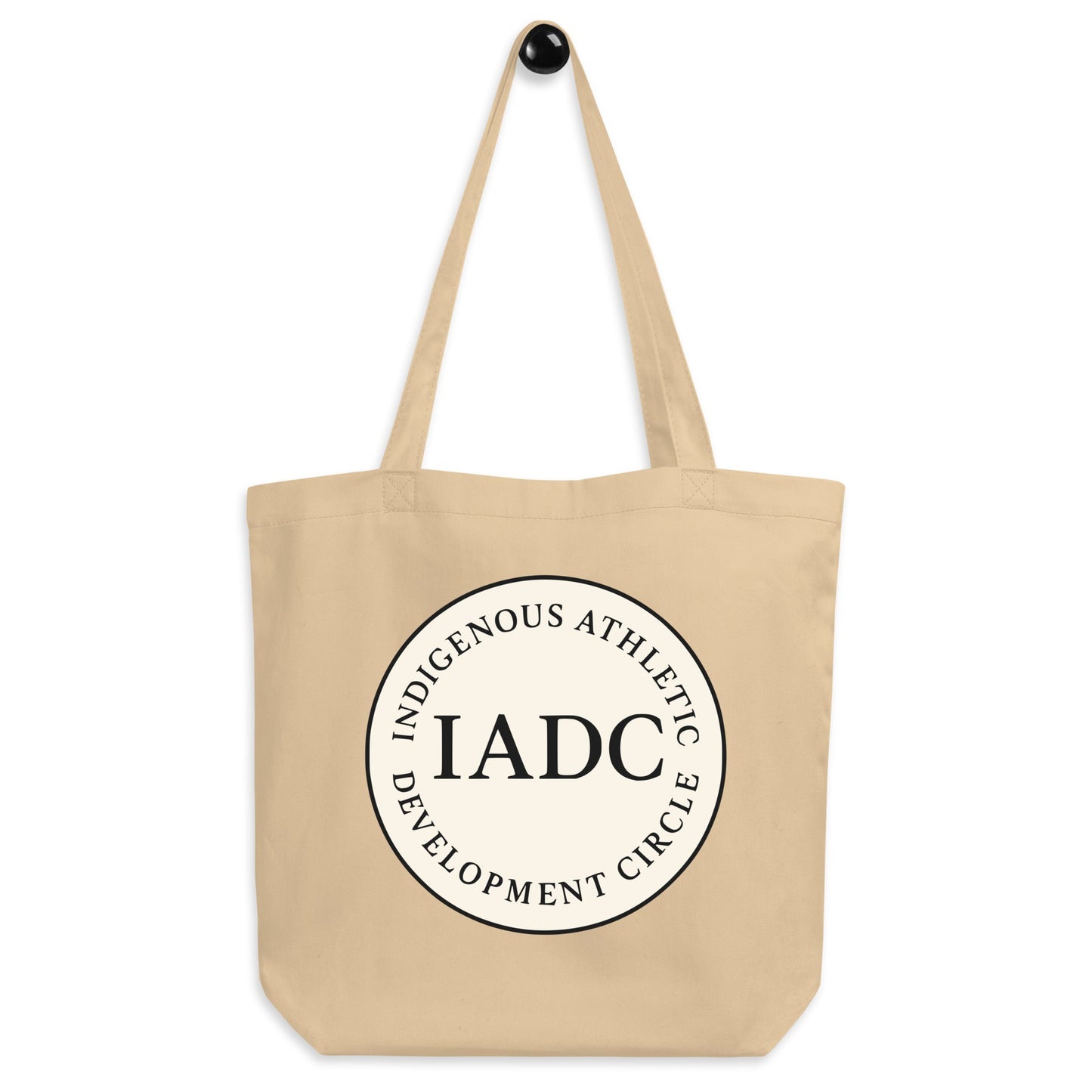 Beige tote bag with 'IADC' logo.