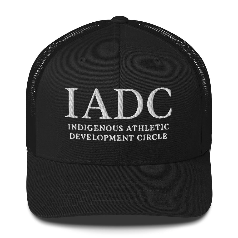 Black cap with 'IADC Indigenous Athletic Development Circle' logo.