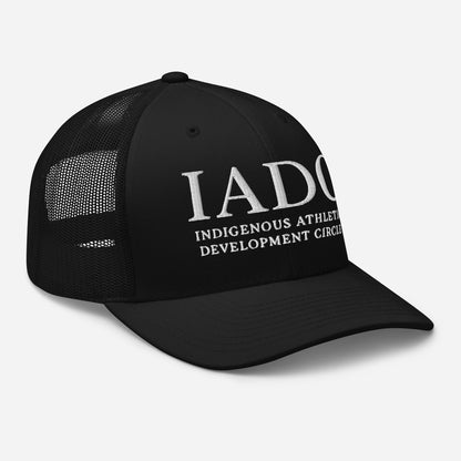 Black cap with 'IADO Indigenous Athletes Development Circle' logo.