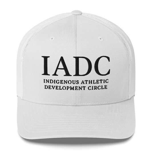 White cap with 'IADC Indigenous Athletic Development Circle' logo.