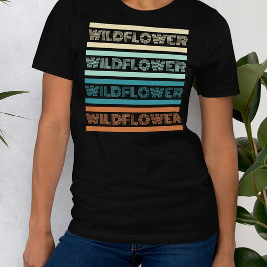 Black t-shirt with 'WILDFLOWER' text in colorful stripes.