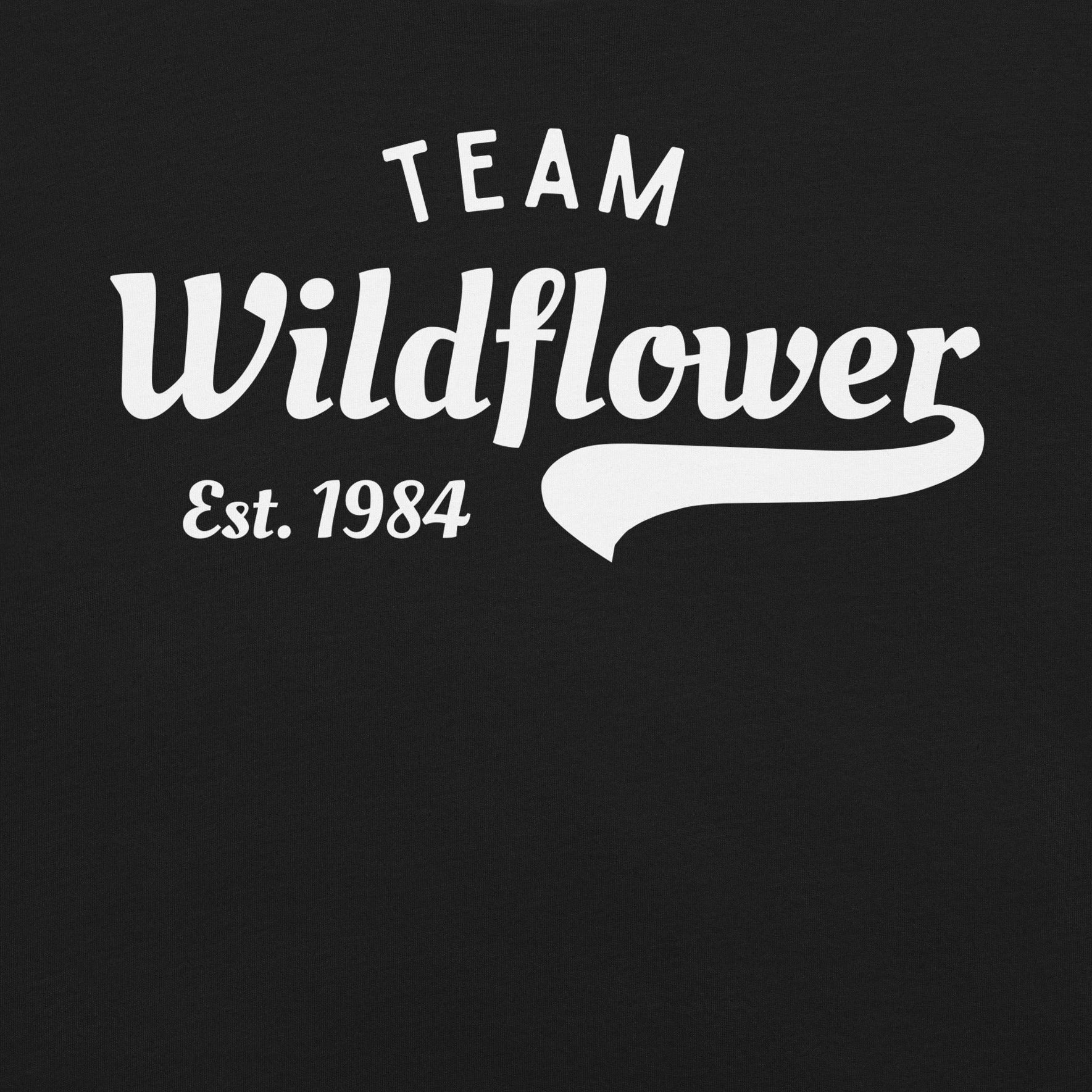 Black t-shirt with 'Team Wildflower Est. 1984' text.