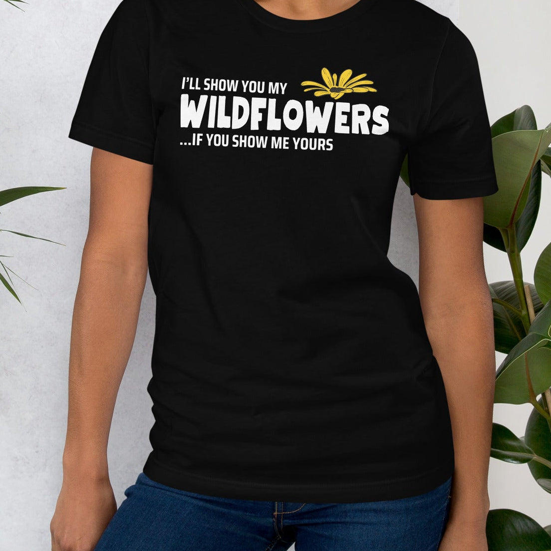 Black t-shirt with text and flower.