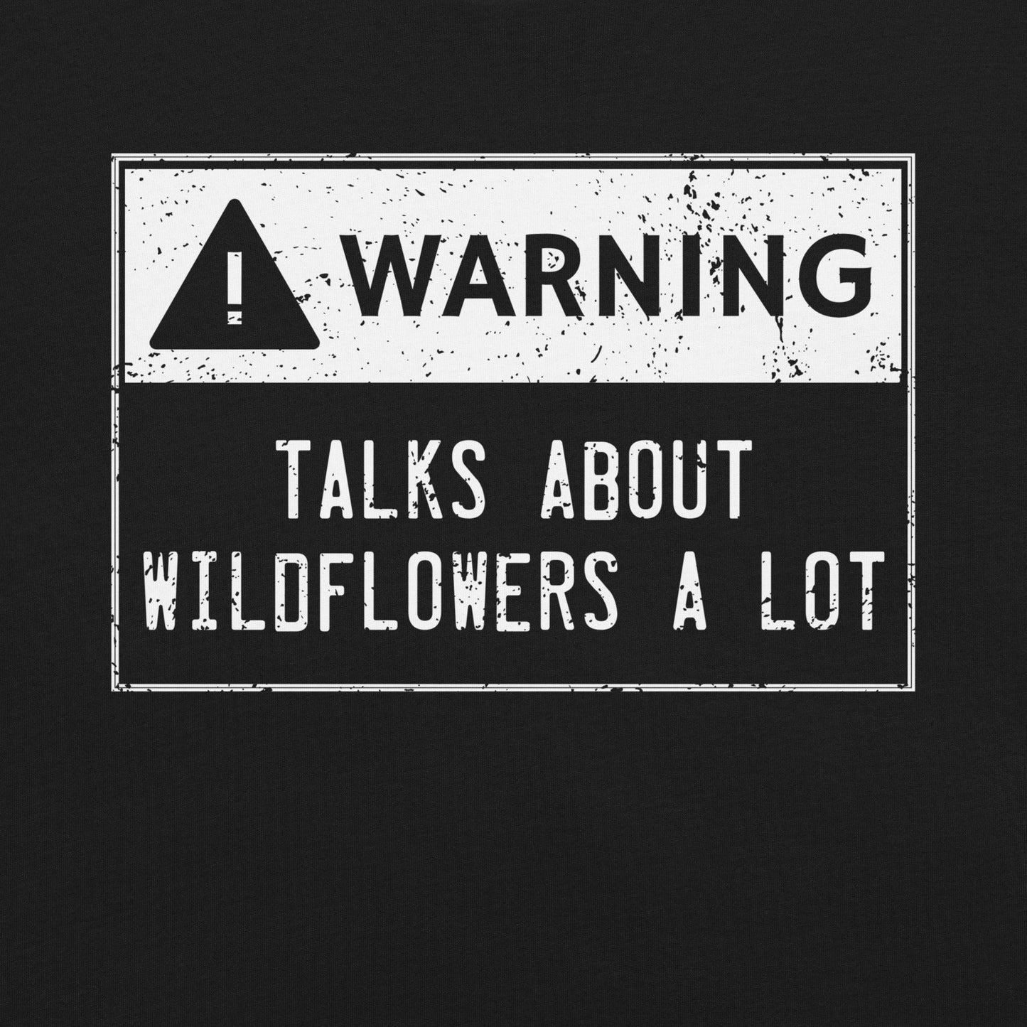 Black t-shirt with text Warning 'TALKS ABOUT WILDFLOWERS A LOT' on a black background