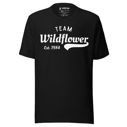 Black t-shirt with 'Team Wildflower Est. 1984' text.