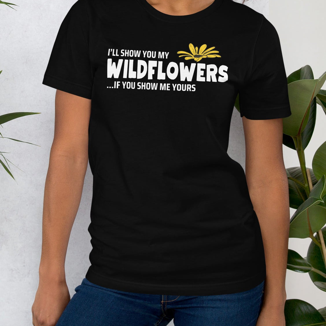 Black t-shirt with 'I'll show you my wildflowers' text and floral graphic.