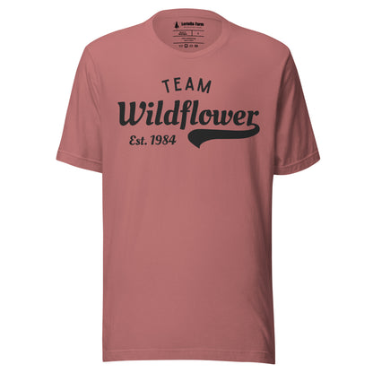 Mauve t-shirt with 'Team Wildflower Est. 1984' text.