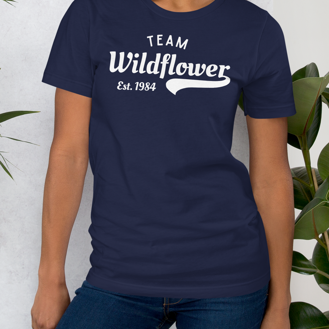 Navy t-shirt with 'Team Wildflower Est. 1984' text.