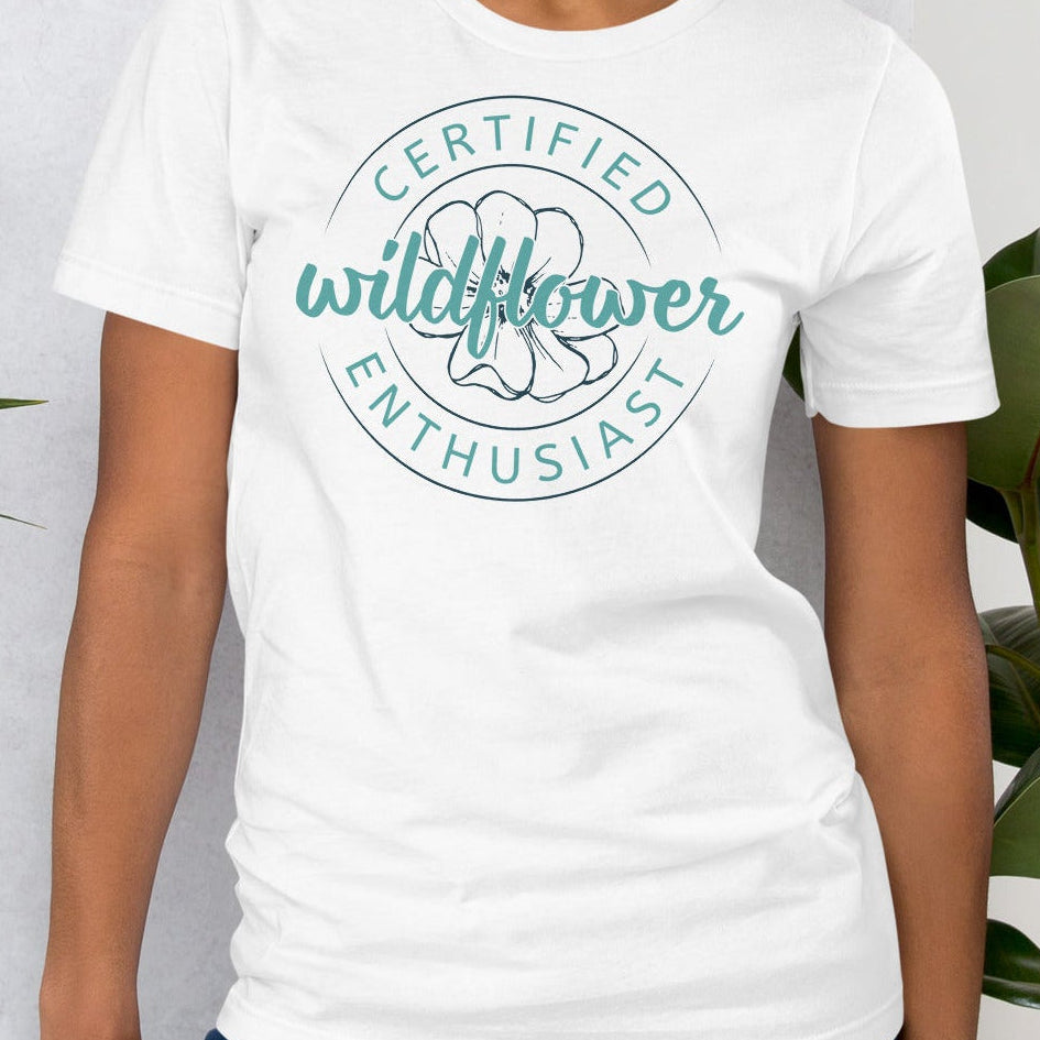 White t-shirt with 'Certified Wildflower Enthusiast' design.