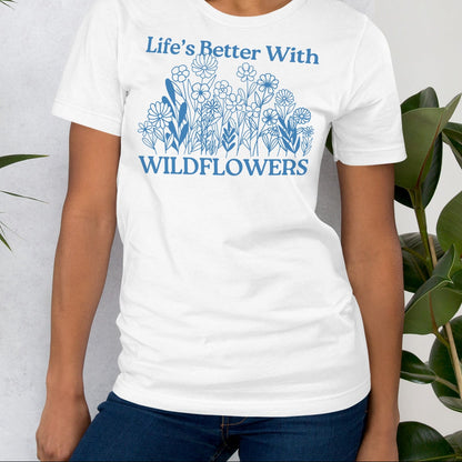 White t-shirt with text and floral design.
