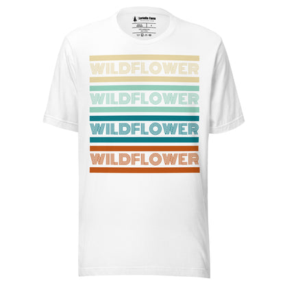 White t-shirt with 'Wildflower' text in colorful stripes.
