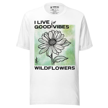 White t-shirt with a flower design and text.