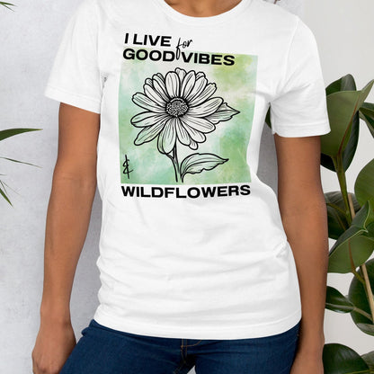 White t-shirt with a flower design and text.