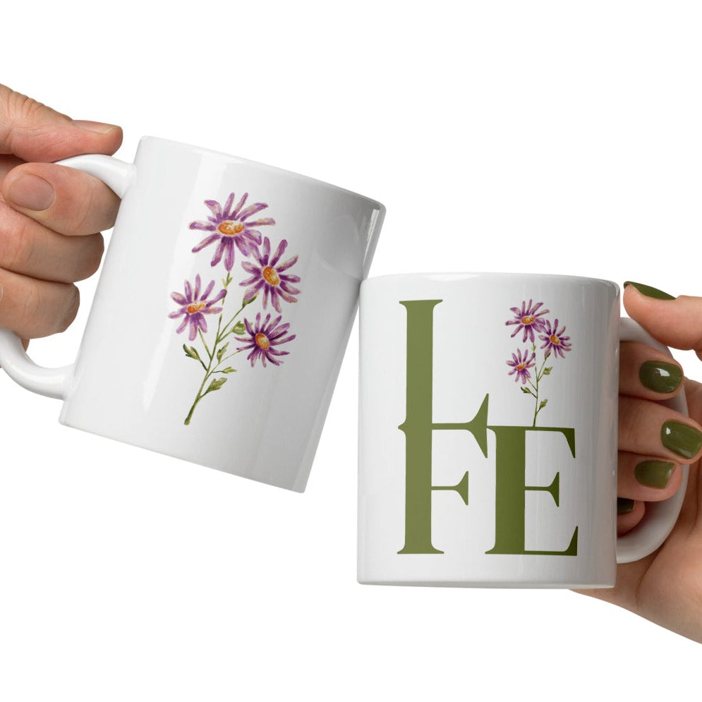 White mugs with floral design and 'LIFE' text.